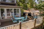 DECK AREA WITH GAS GRILL, TABLES & CHAIRS